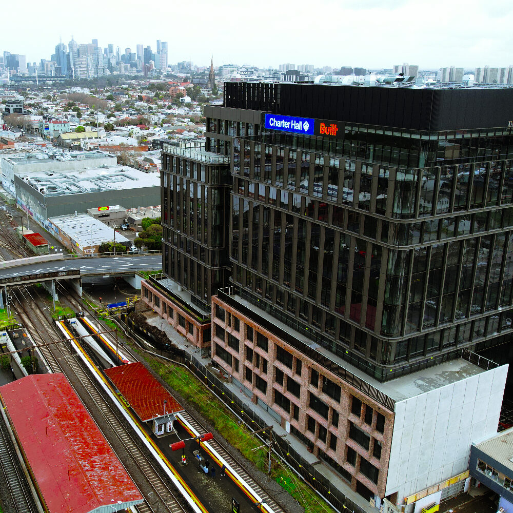 Lightweight Truecore steel framing custom modular façade with brick-slip system on Australia Post National Support Centre building at 480 Swan Street in Richmond, Melbourne, Victoria, next to Burnley Station, designed by CMG Frames.