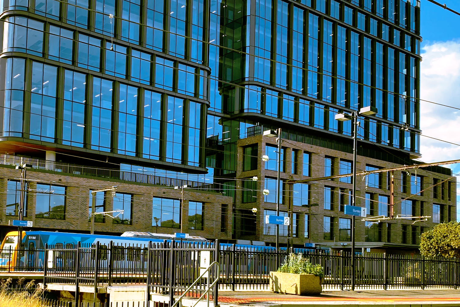 Lightweight Truecore steel framing custom modular façade with brick-slip system on Australia Post National Support Centre building at 480 Swan Street in Richmond, Melbourne, Victoria, next to Burnley Station, designed by CMG Frames.