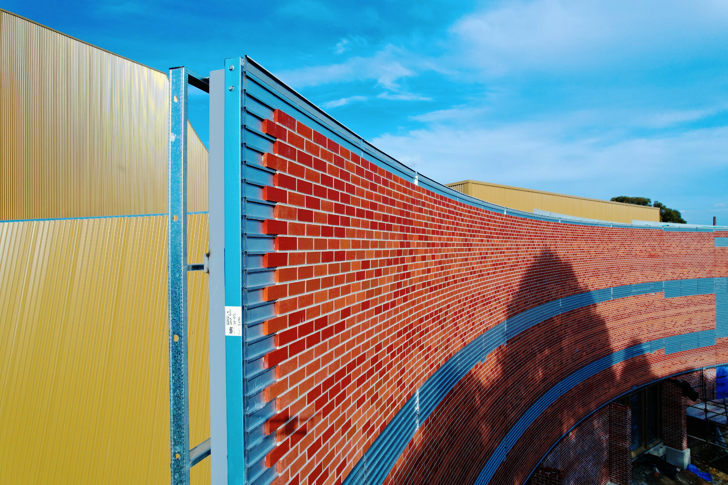 The Round Whitehorse Performing Arts Centre in Nunawading, Melbourne, with a brick-slip light guage steel frame face designed by CMG Frames.