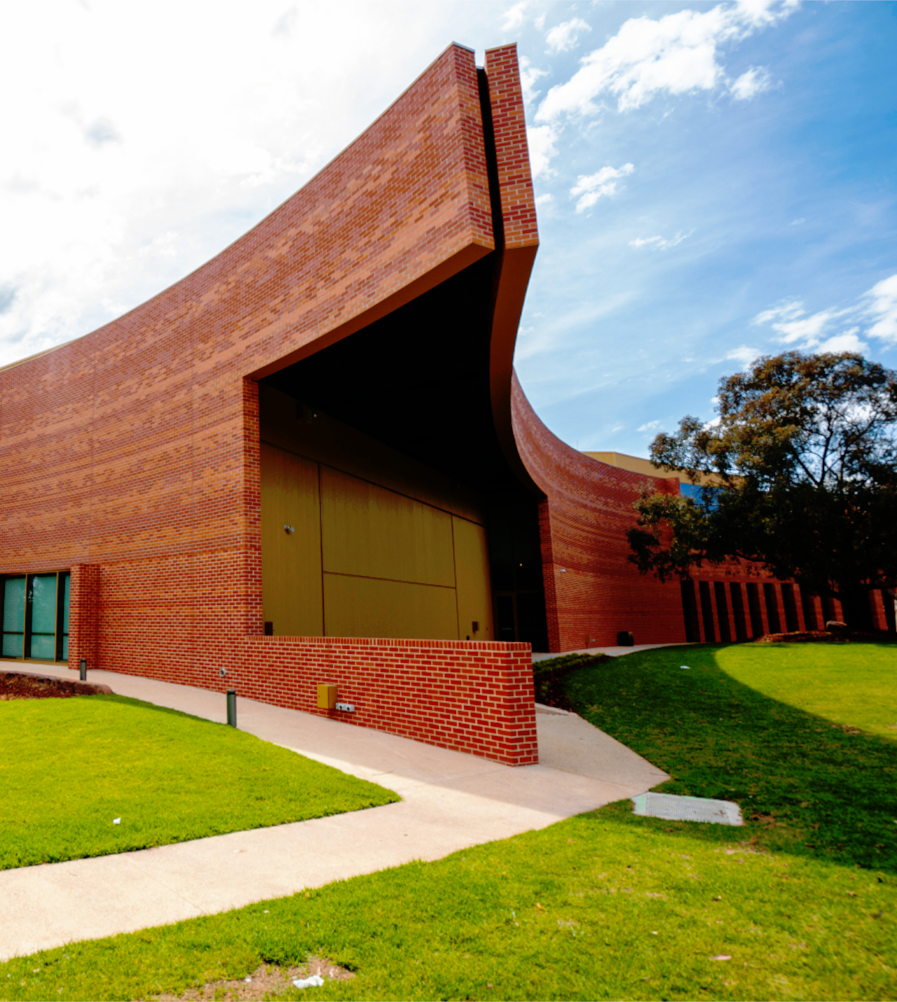 The Round Whitehorse Performing Arts Centre in Nunawading, Melbourne, with a brick-slip light guage steel frame face designed by CMG Frames.
